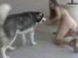 Dog harasses naked girl